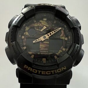 G-Shock GA-100CF Black with Gold Hands and Camouflage Details on Face